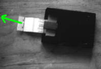 A film pack with 'top' white tab exposed